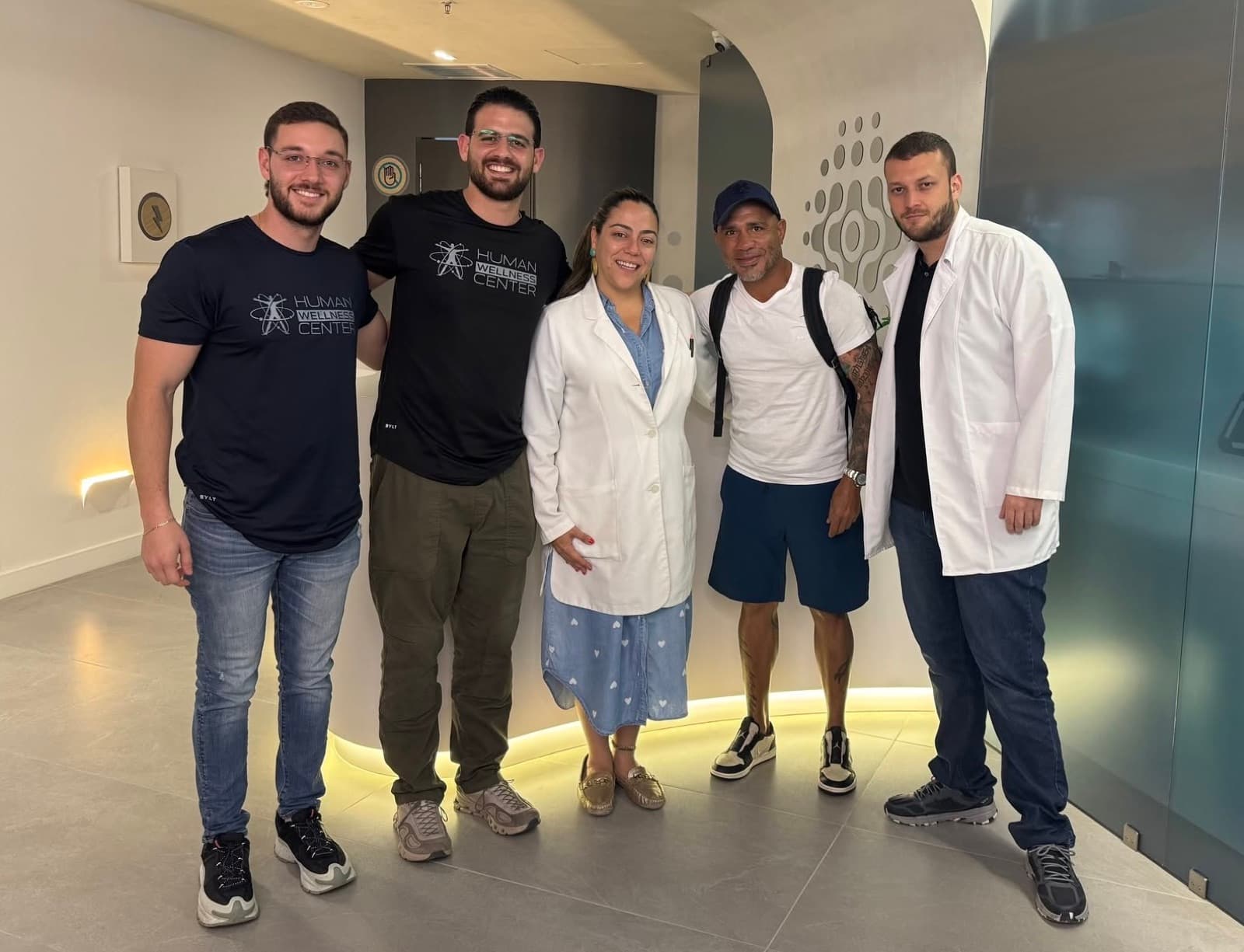 Miguel Cotto visiting Human Wellness Center with the team