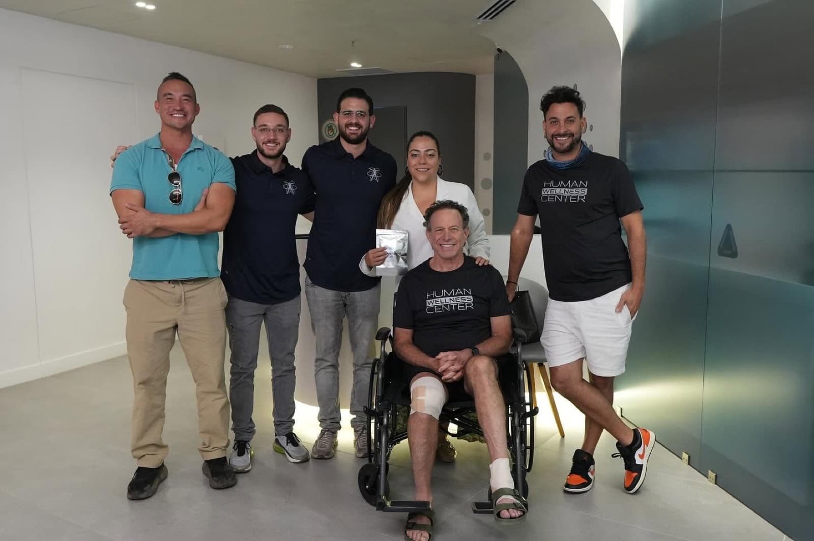 A patient with his care team after treatment at Human Wellness Center
