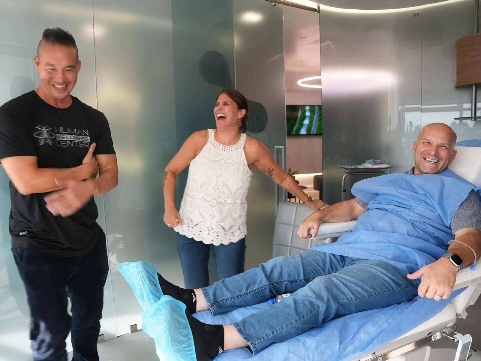 Patients laughing with the team in the treatment suite