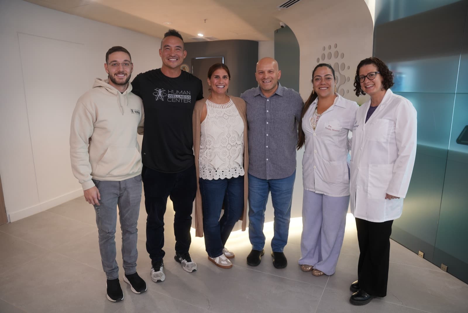 Michael with the Human Wellness Center care team in the treatment suite